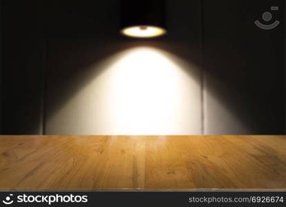 Empty dark wooden table in front of abstract blurred bokeh background of restaurant . can be used for display or montage your products.Mock up for space