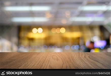Empty dark wooden table in front of abstract blurred bokeh background of restaurant . can be used for display or montage your products.Mock up for space 