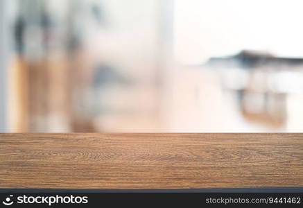 Empty dark wooden table in front of abstract blurred bokeh background of restaurant . can be used for display or montage your products.Mock up for space 