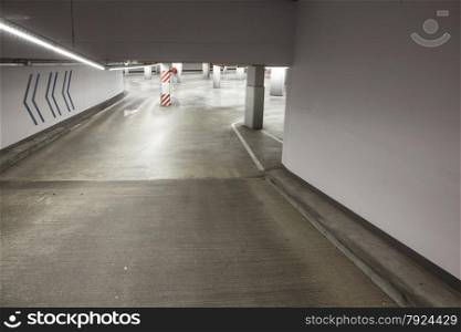 empty driveway in deserted concrete parking garage