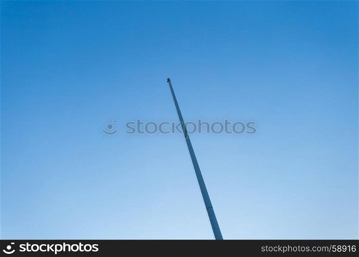 empty flagstaff on blue sky