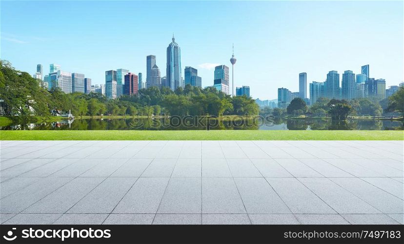 Empty floor with park and modern cityscape . Morning scene .