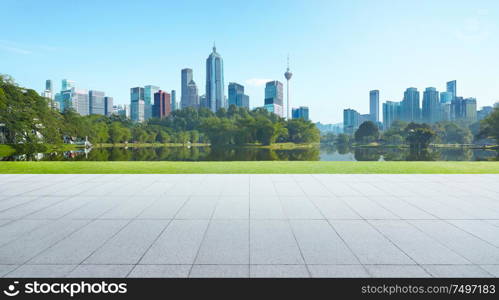 Empty floor with park and modern cityscape . Morning scene .