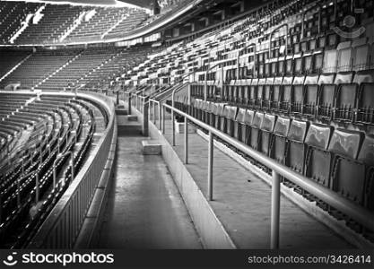 Empty football, soccer stadium grandstand in black and white