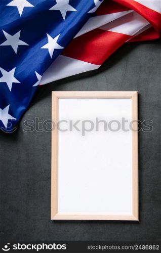 Empty frame for text and American flag on a dark background. Concept of celebrating national holidays - Independence Day, Memorial Day or Labor Day.. Empty frame for text and American flag on dark background. Concept of celebrating national holidays - Independence Day, Memorial Day or Labor Day.