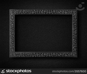 Empty frame on black wall.