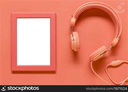 empty frame pink earphones colored surface. High resolution photo. empty frame pink earphones colored surface. High quality photo