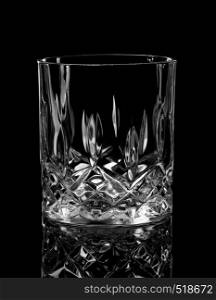 Empty glass for whiskey on a black background