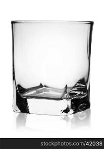 Empty glass for whiskey rotated isolated on white background