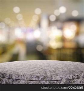 Empty granite round table and blurred background for product presentation