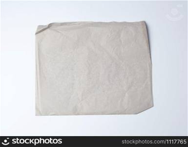 empty gray crumpled sheet of paper, full frame, close up