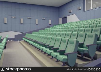empty green armchairs in modern theater Hall