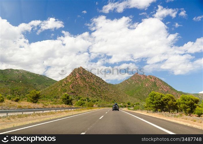 empty highway road in mountain landscape in spain