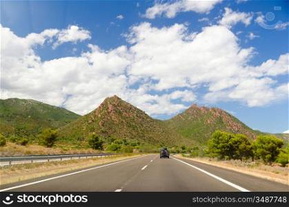 empty highway road in mountain landscape in spain