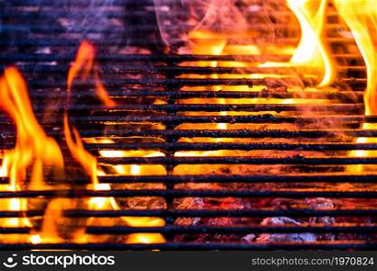 Empty hot charcoal barbecue grill with bright flame
