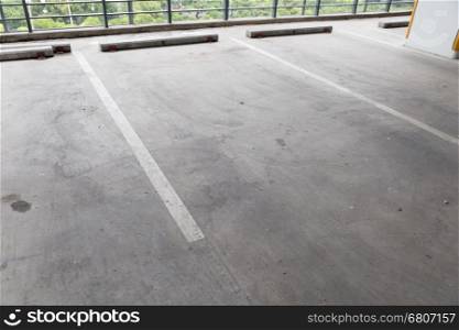 empty indoor car parking lot in building