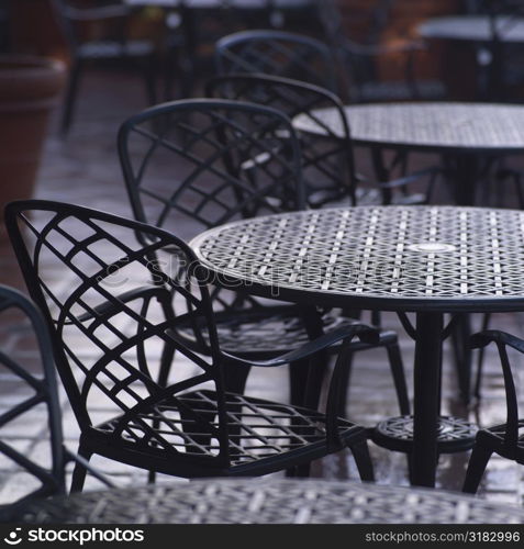 Empty iron tables and chairs