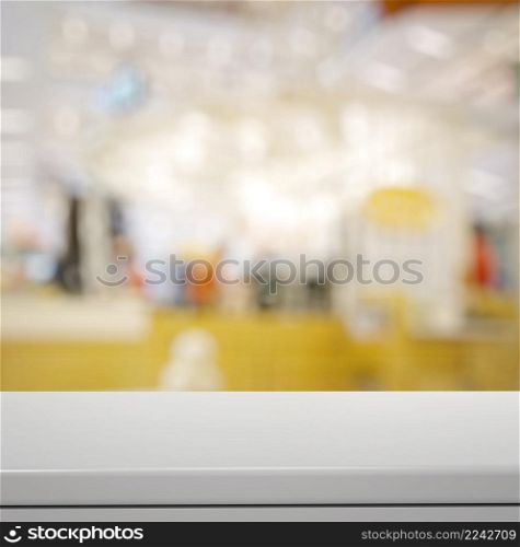 Empty laminate shelf and blurred background for business product presentation