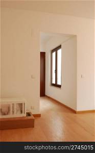 empty living room with window and wooden floor
