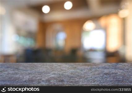 Empty marble stone table in front of abstract blurred background of restaurant, cafe and coffee shop interior. can be used for display or montage your products - Image