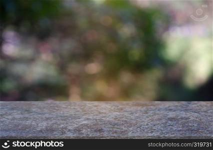 Empty marble stone table in front of abstract blurred green of garden and nature light background. For montage product display or design key visual layout - Image