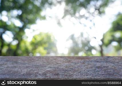 Empty marble stone  table in front of abstract blurred green of garden and trees background. For montage product display or design key visual layout - Image 