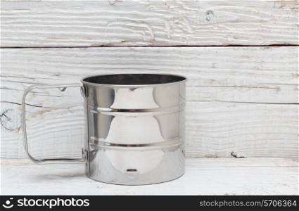empty metal mug on old wooden table