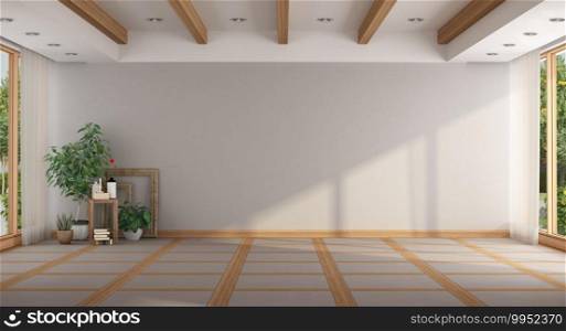 Empty minimalist large room with plants, window and wooden roof beams - 3d rendering. Empty minimalist large room