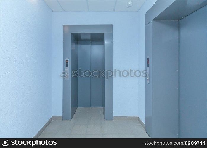 empty modern elevator or lift with closed metal doors. modern elevator doors