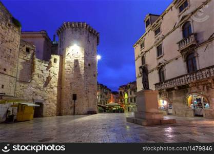 Empty Night Fruit square and Venetian Tower in the Diocletian Palace section of Medieval Old town of Split, Croatia. Old Town of Split, Croatia