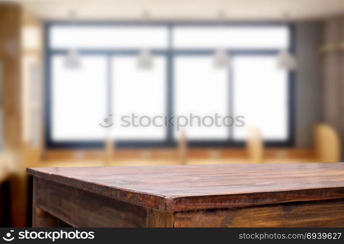 Empty of wood table top on blur of window glass in the morning background. for your photomontage or product display