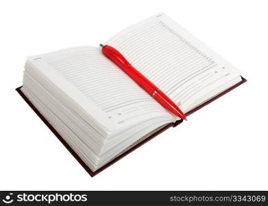 Empty open diary and red ball point pen. Close-up. Isolated on white background.