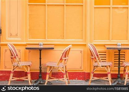 Empty outdoor cafe in Paris. Summer empty open air restaraunt in Europe.
