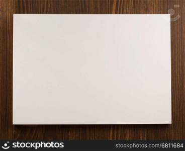 empty paper blank sheet on wooden background