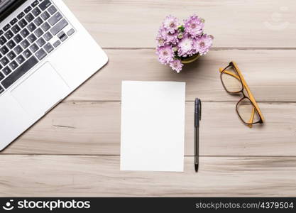 empty paper sheet pen notebook glasses flowers table