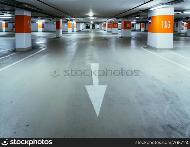 Empty parking garage in the underground. Nobody.