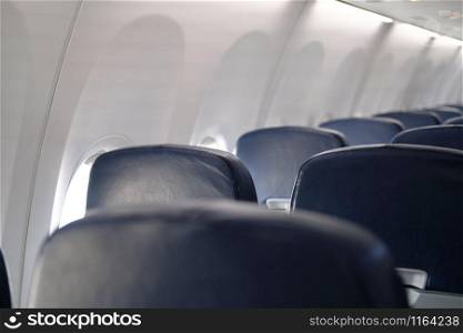 empty passenger seat inside airplane. row of chair in aircraft
