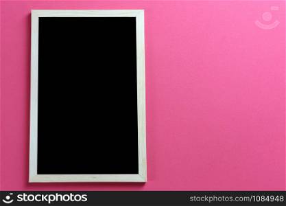 Empty photo frame on red art paper background and have copy space.