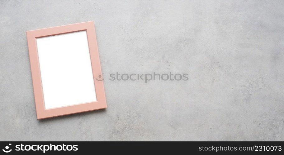 Empty pink wooden frame on grey background, copy space for mock up and template