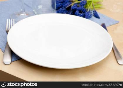 Empty Plate and Silverware on Table in Restaurant