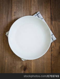 empty plate on a wooden table