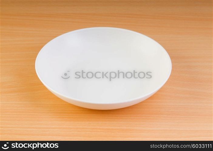 Empty plate on the wooden table