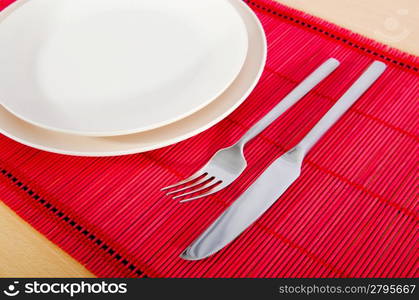 Empty plate with utensils