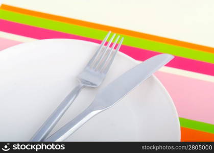 Empty plate with utensils