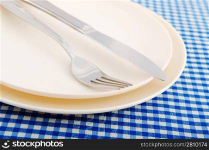 Empty plate with utensils