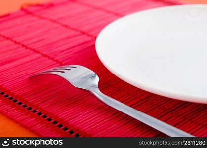 Empty plate with utensils