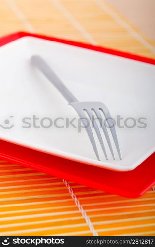 Empty plate with utensils