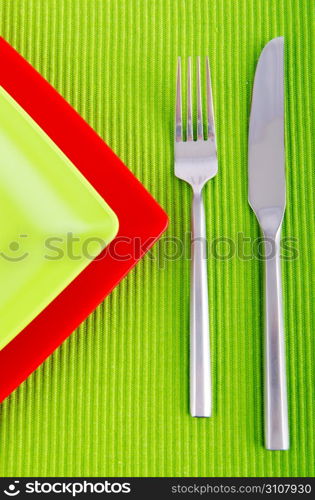 Empty plate with utensils