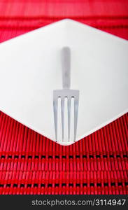 Empty plate with utensils