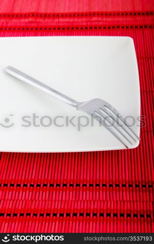 Empty plate with utensils